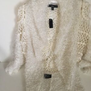 One sequined tank top. A white sweater. Selling 2